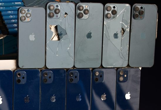 Broken iPhones are seen as a part of replica of Formula E car made by used electronics, on the opening day of the United Nations Climate Change Conference COP28 in Dubai, United Arab Emirates on November 30, 2023.
