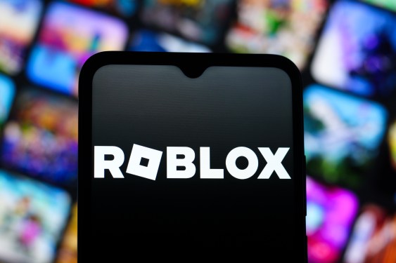 In this photo illustration, the Roblox Corporation logo is seen displayed on a smartphone screen.
